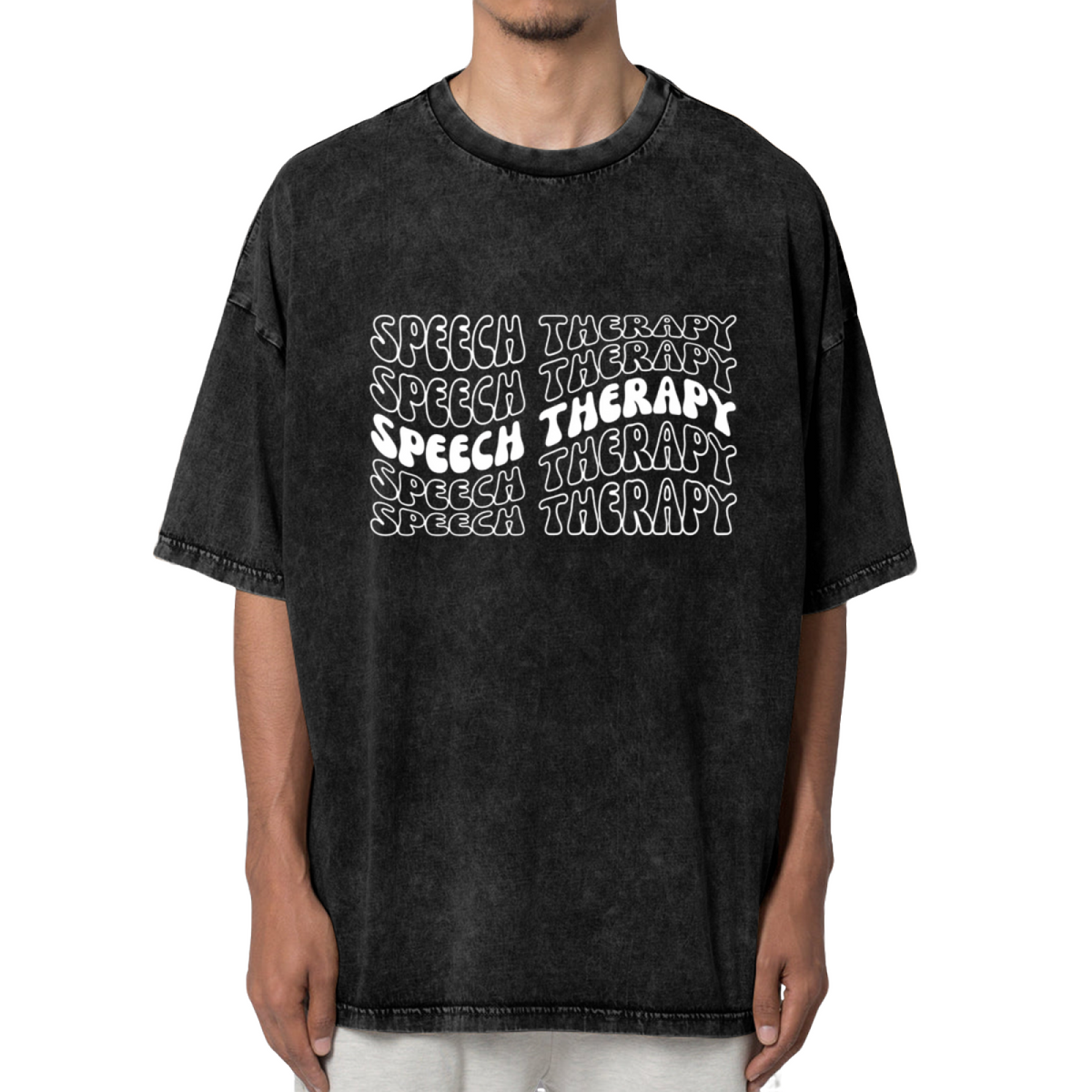 Product image of washed graphic T-shirt featuring 'Speech Therapy' statement design