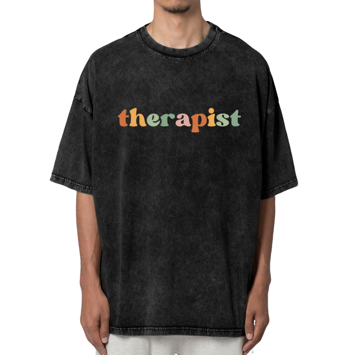 Product image of washed graphic T-shirt featuring 'Therapist' statement design