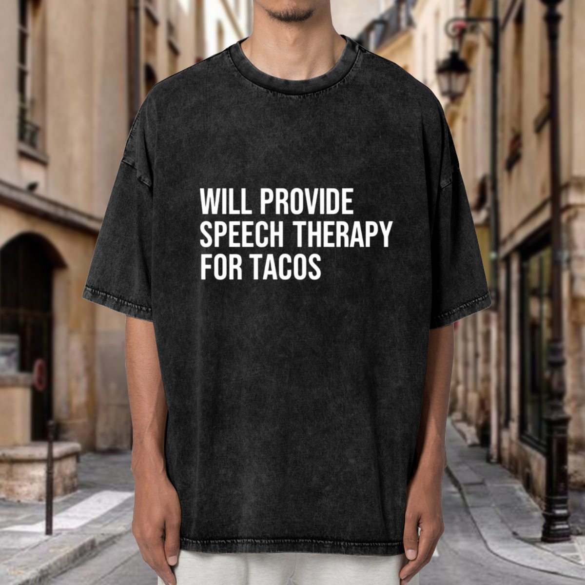 Product image of washed graphic T-shirt featuring 'Will Provide Speech Therapy for Tacos' statement design