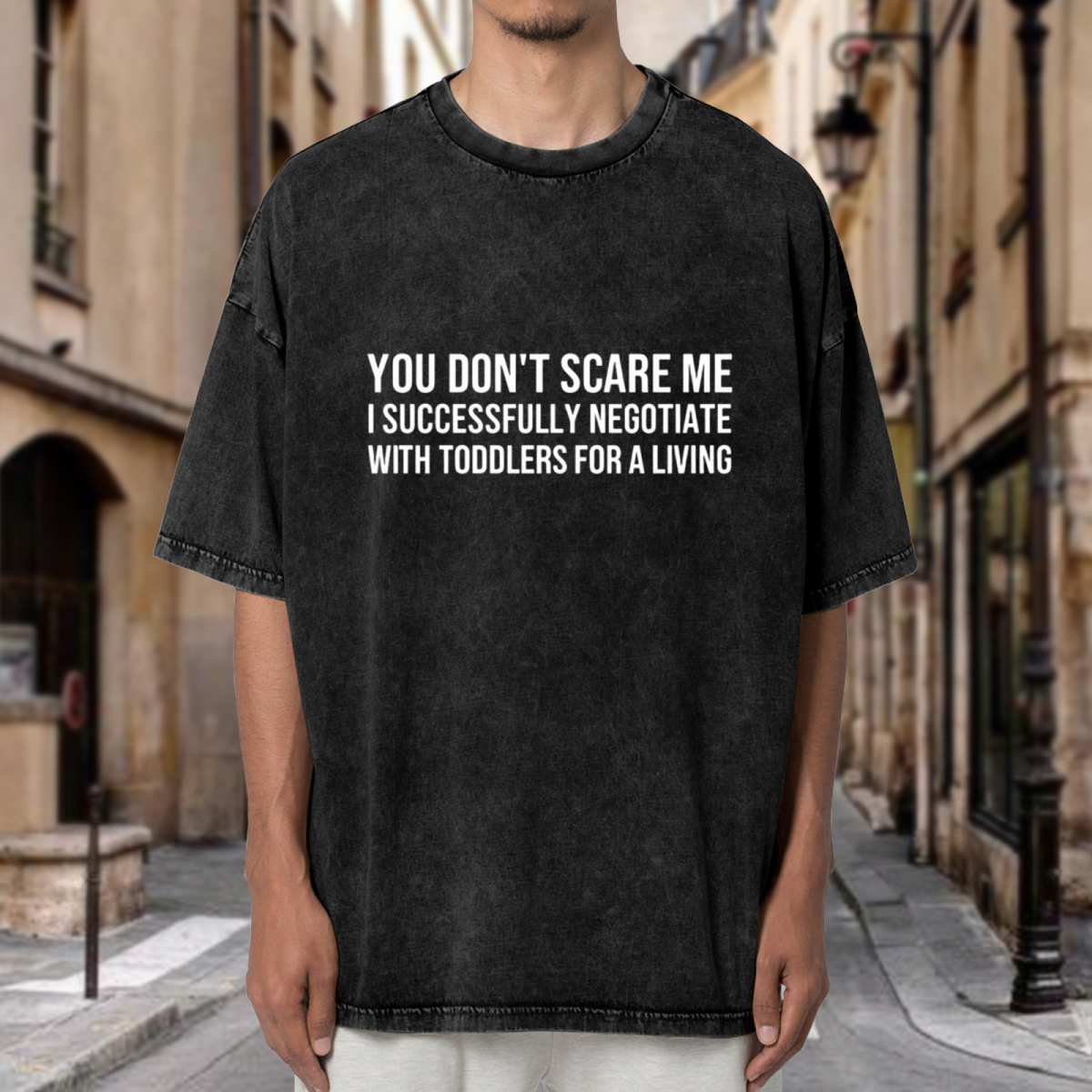 Unisex washed graphic T-shirt with You Don't Scare Me I Successfully Negotiate With Toddlers For A Living themed design, product image