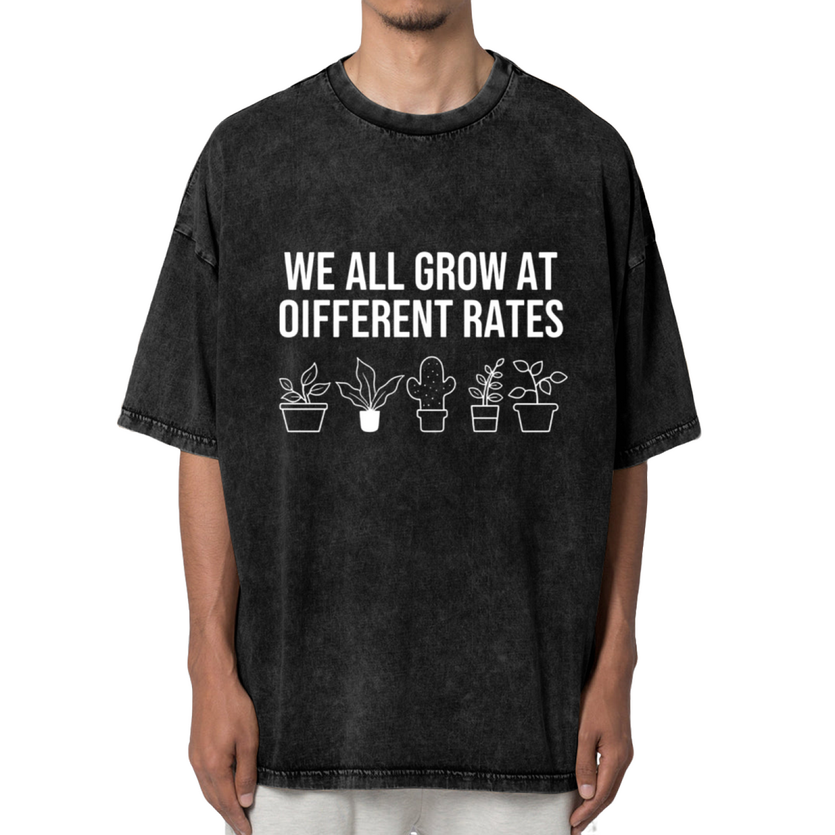 Unisex washed graphic T-shirt with We All Grow At Different Rates themed design, product image