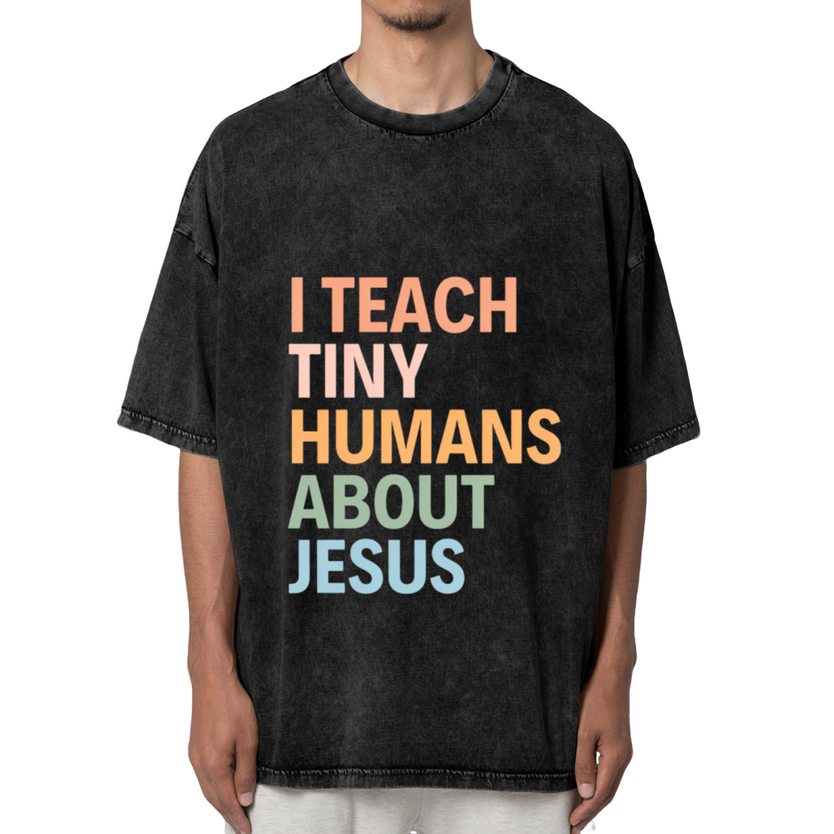 Unisex washed graphic T-shirt with I Teach Tiny Humans About Jesus themed design, product image