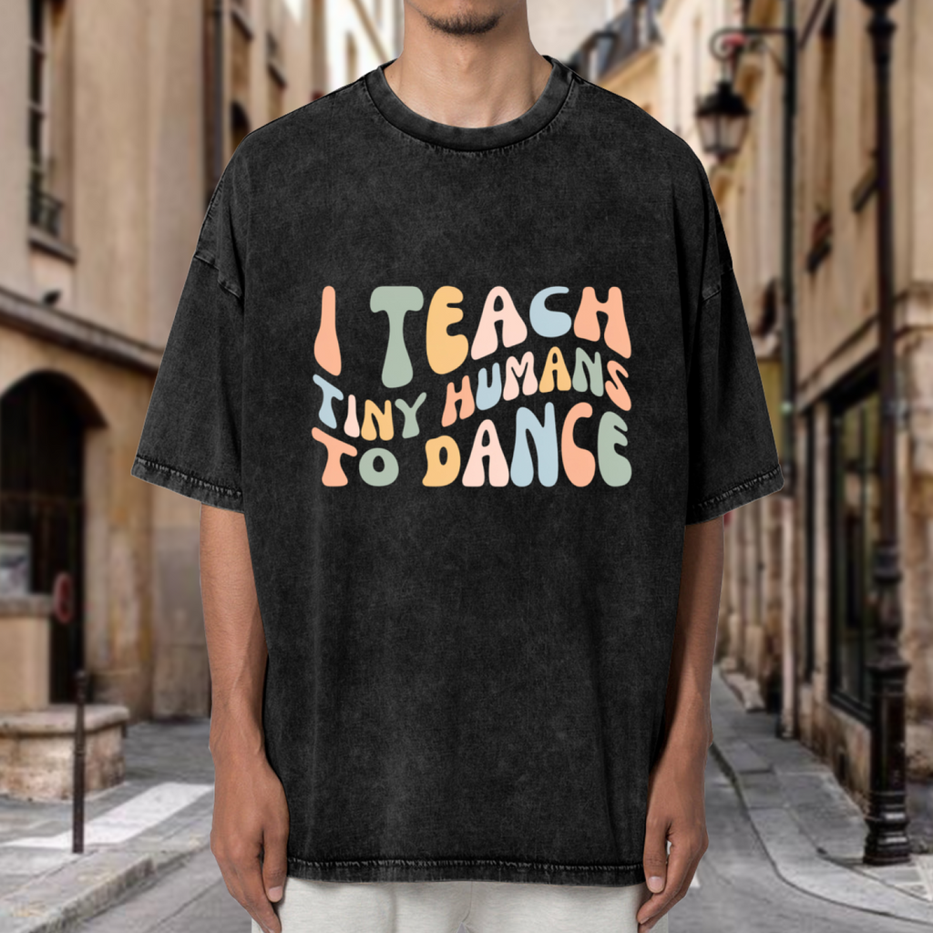 Unisex washed graphic T-shirt with I Teach Tiny Humans To Dance themed design, product image
