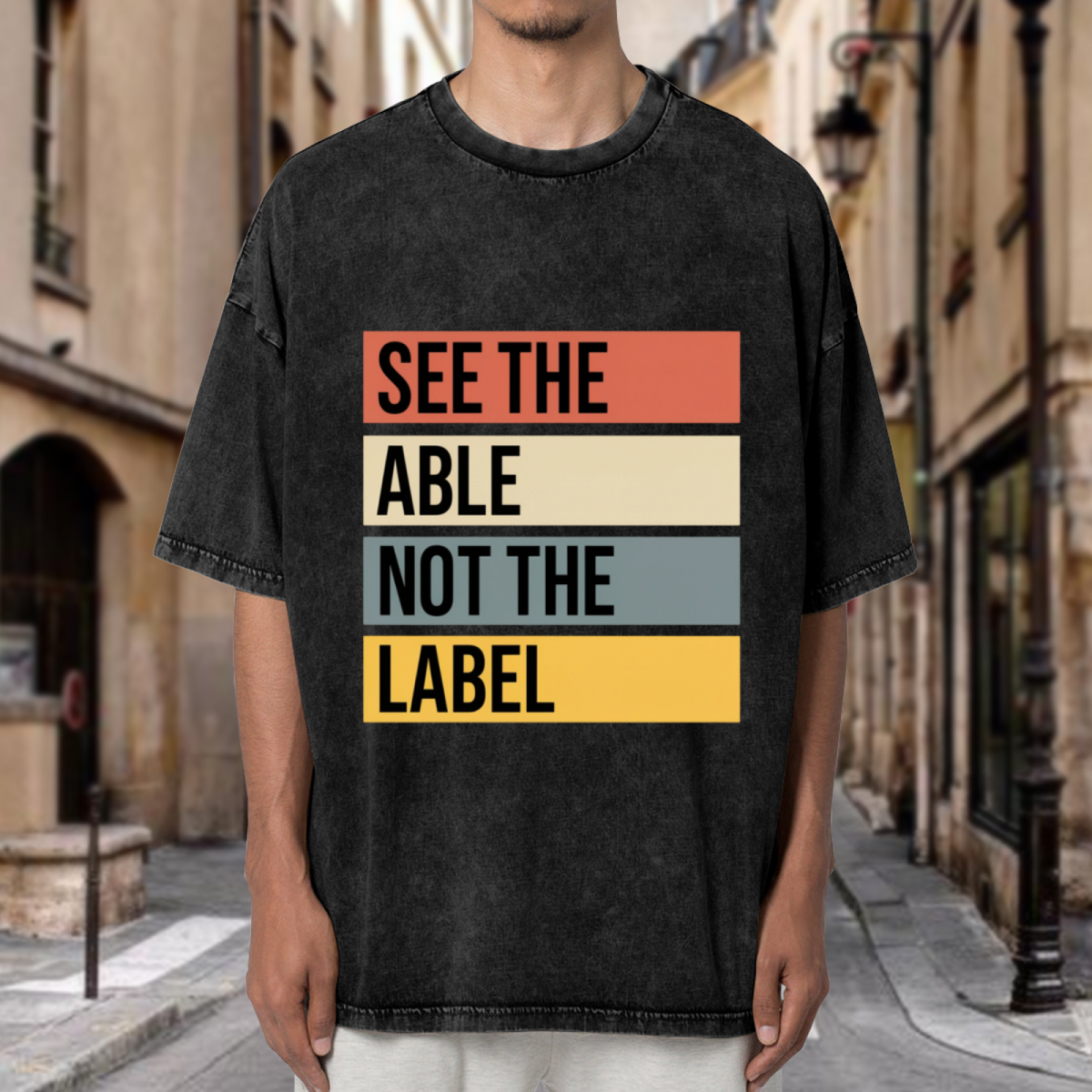 Product image of washed graphic T-shirt featuring 'See the Able Not the Label Autism' statement design