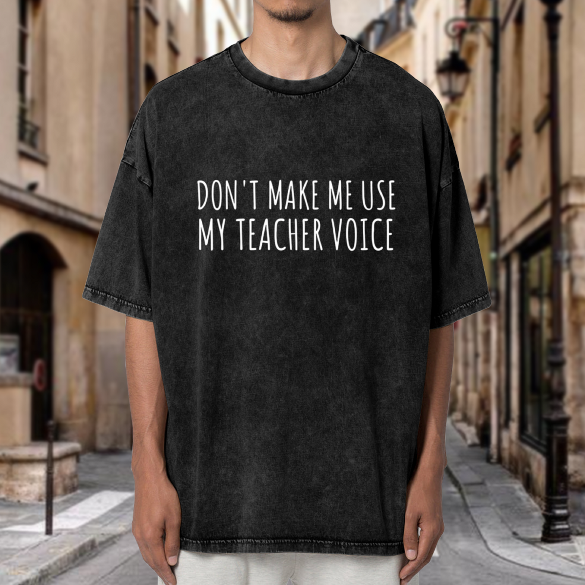 Unisex washed graphic T-shirt with Don't Make Me Use My Teacher Voice themed design, product image