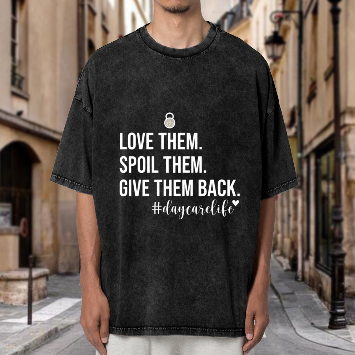 Unisex washed graphic T-shirt with Love Them Spoil Them Give Them Back Daycare Teacher themed design, product image