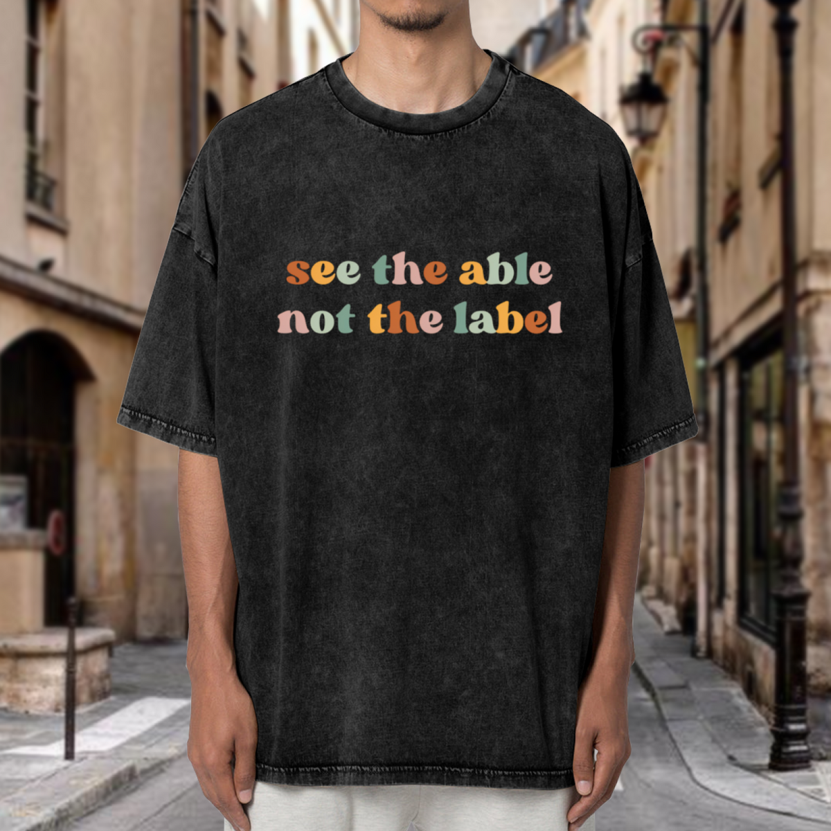 Unisex washed graphic T-shirt with See The Able Not The Label themed design, product image