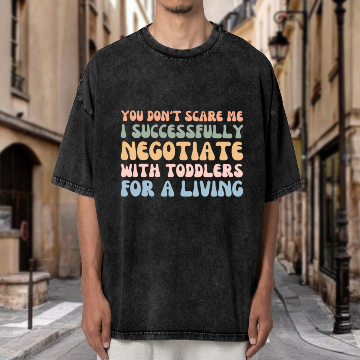 Unisex washed graphic T-shirt with You Don't Scare Me I Successfully Negotiate With Toddlers For A Living themed design, product image