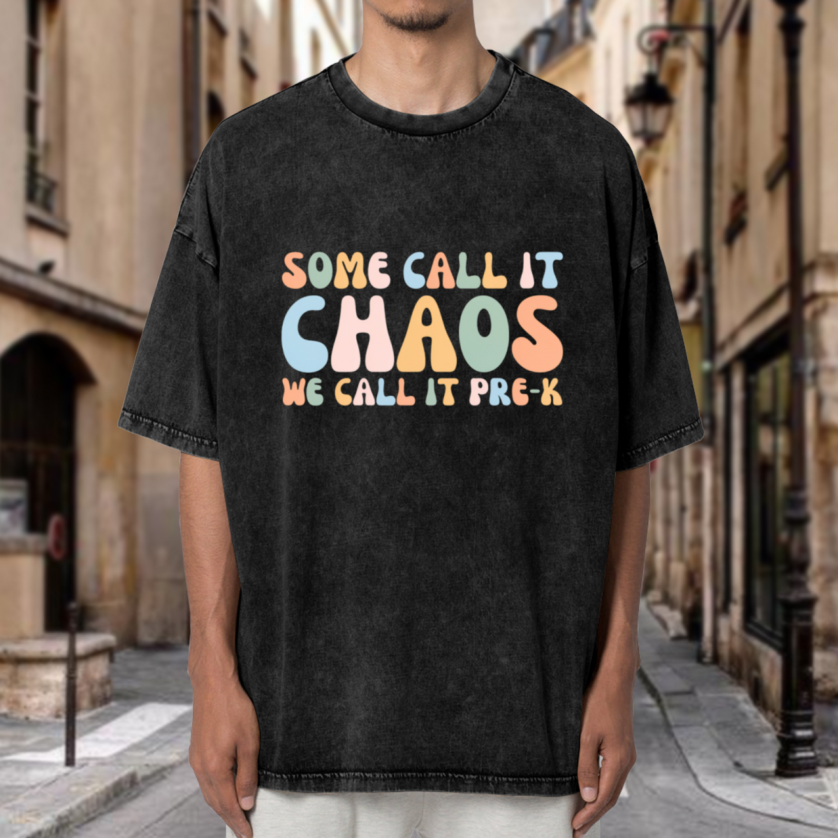 Unisex washed graphic T-shirt with Some Call It Chaos We Call It Pre-K themed design, product image