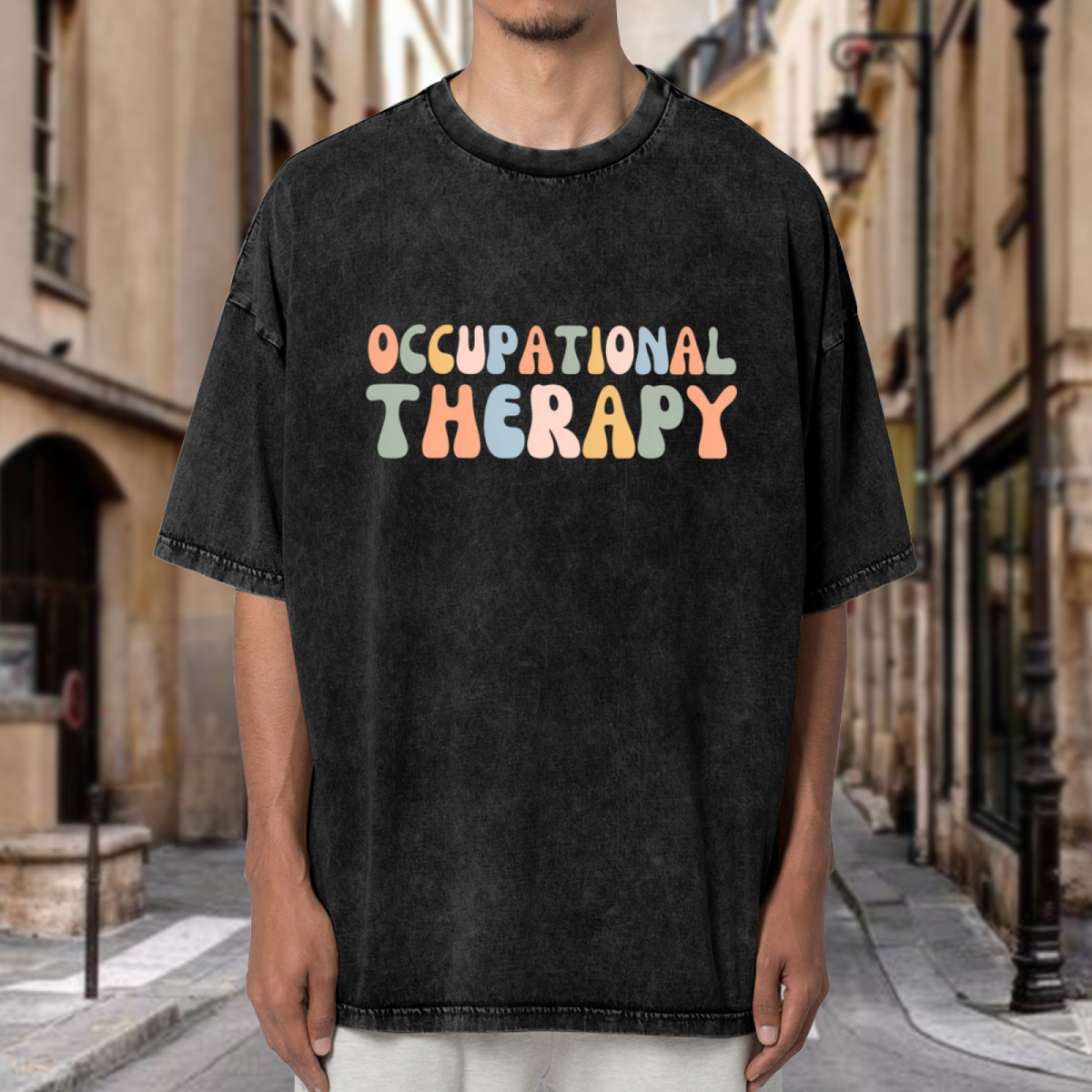 Product image of washed graphic T-shirt featuring 'Occupational Therapy' statement design