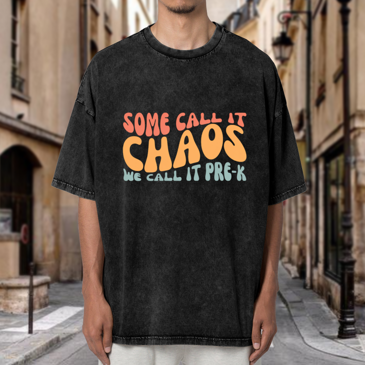 Unisex washed graphic T-shirt with Some Call It Chaos We Call It Pre-k themed design, product image