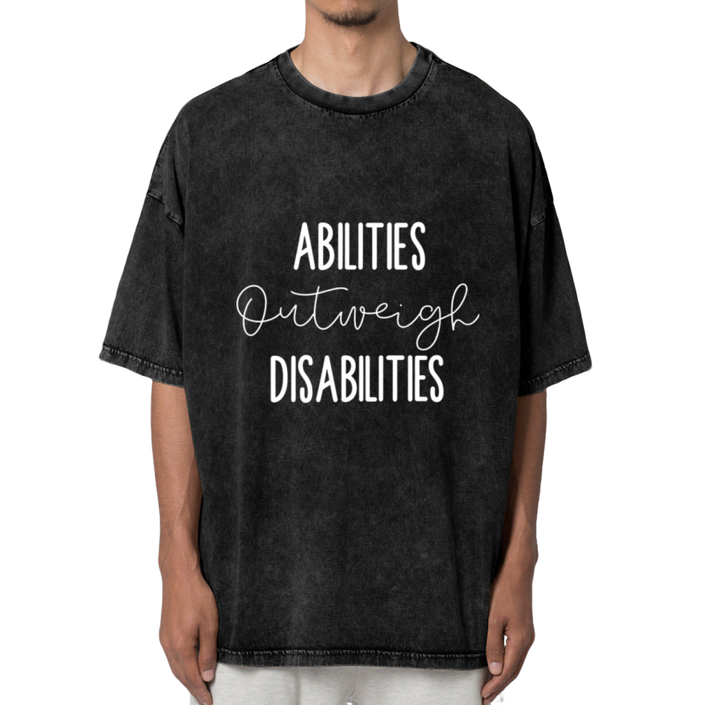 Unisex washed graphic T-shirt with Abilities Outweigh Disabilities themed design, product image