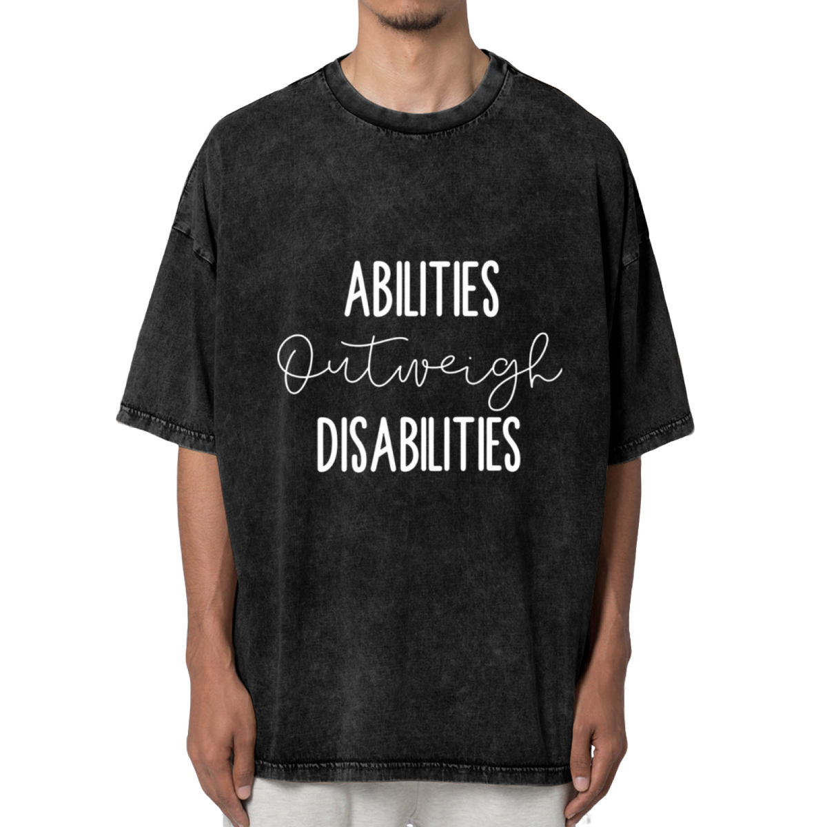 Unisex washed graphic T-shirt with Abilities Outweigh Disabilities themed design, product image