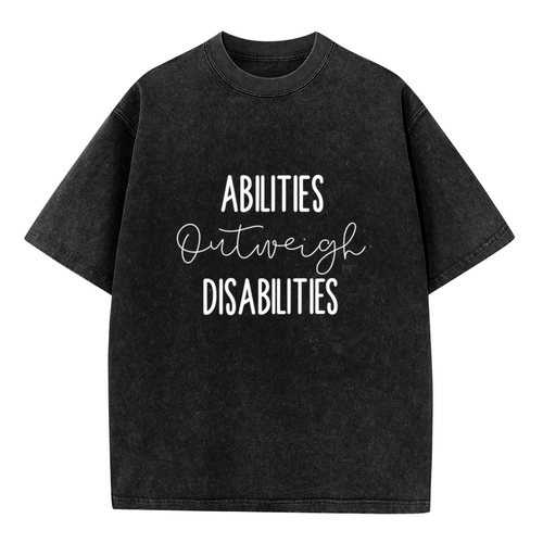 Unisex washed graphic T-shirt with Abilities Outweigh Disabilities themed design, product image