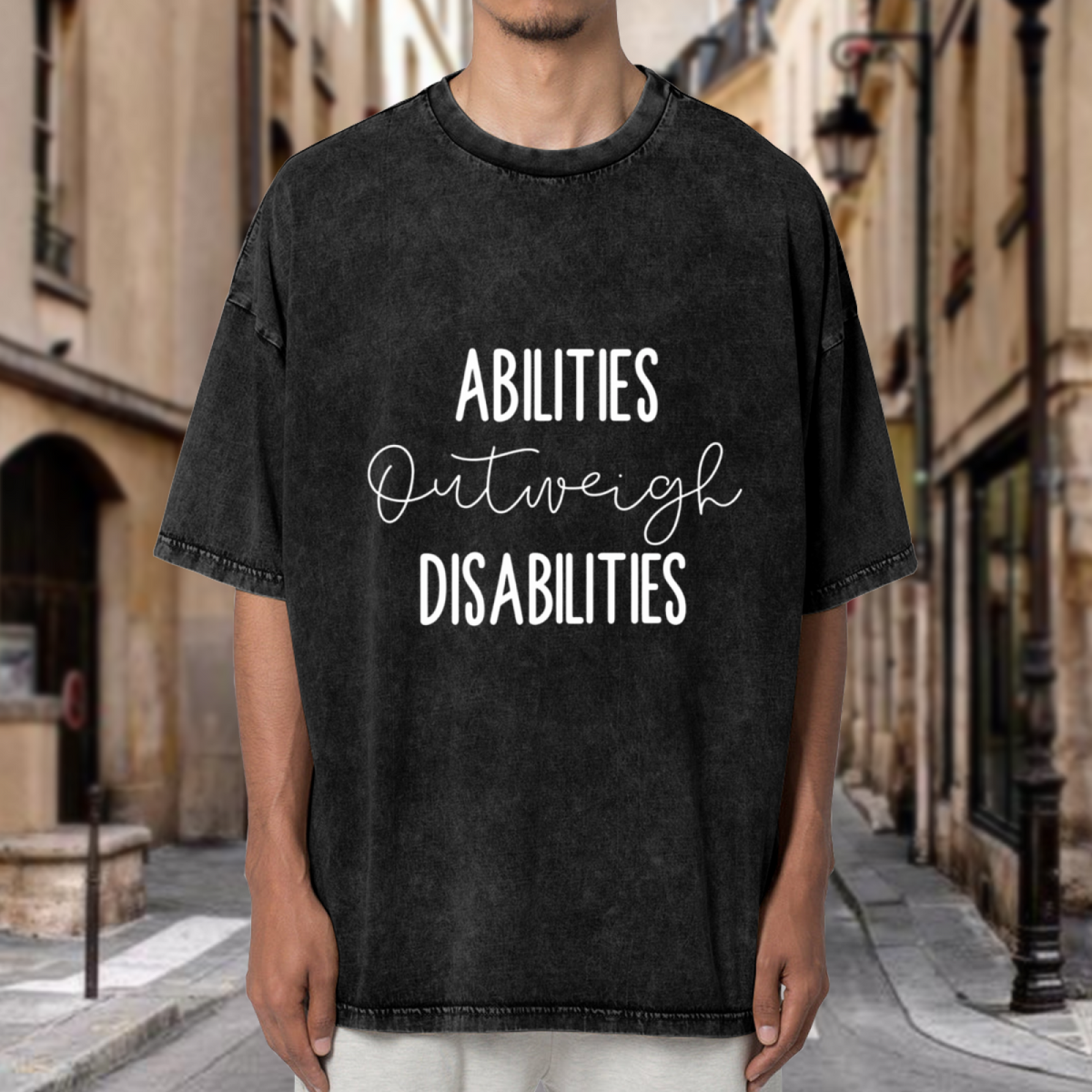 Unisex washed graphic T-shirt with Abilities Outweigh Disabilities themed design, product image
