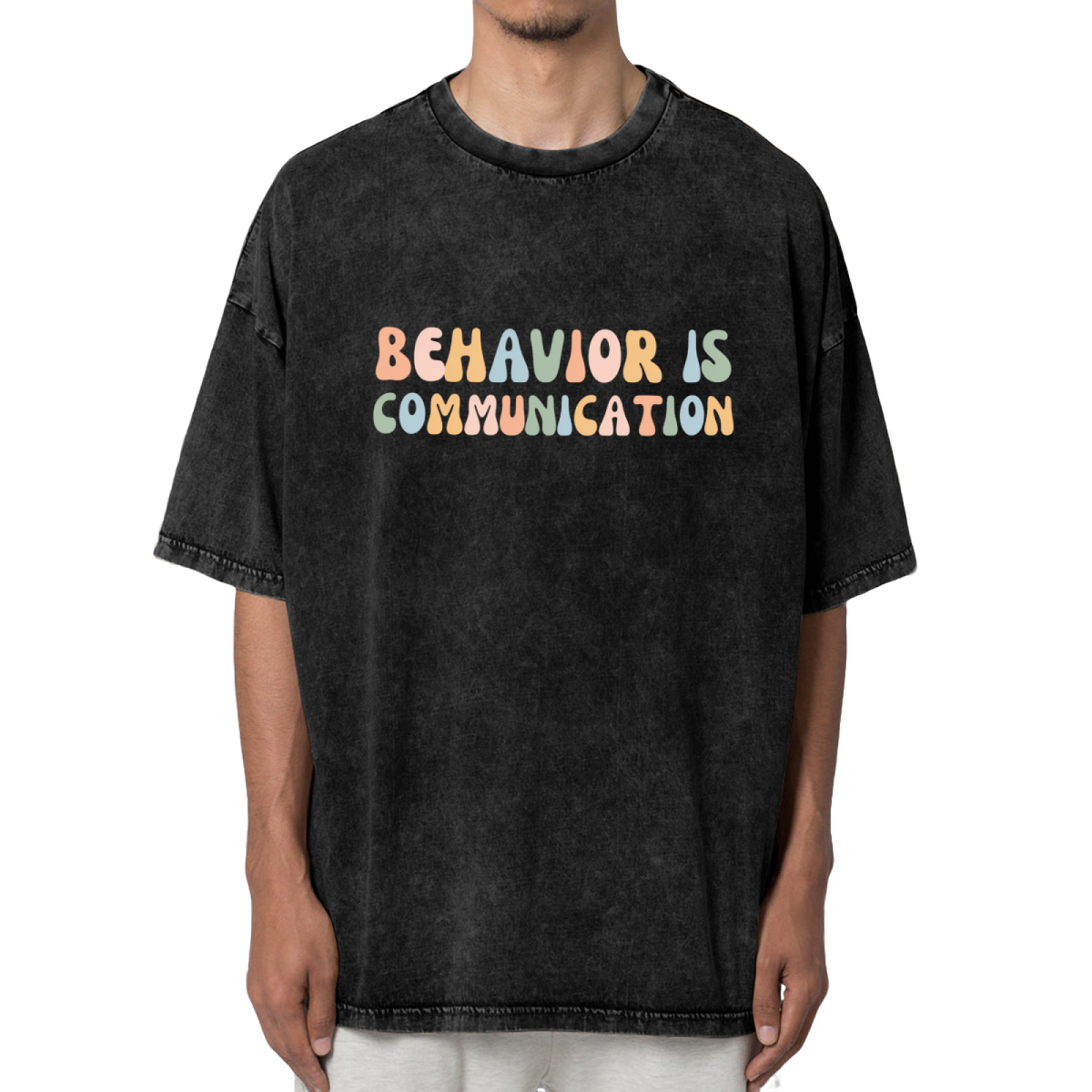 Unisex washed graphic T-shirt with Behavior Is Communication themed design, product image